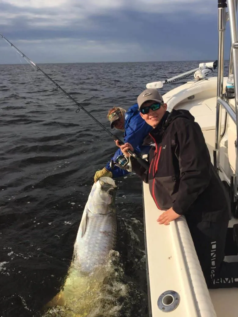 An angler on a Charlotte Harbor tarpon fishing trip